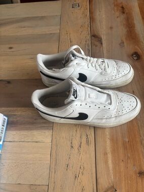 Nike White Low-Top Sneakers with Black Swoosh Accent